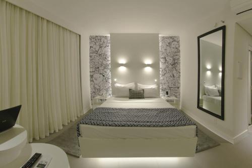 Ένα ή περισσότερα κρεβάτια σε δωμάτιο στο ibis Styles Boa Vista