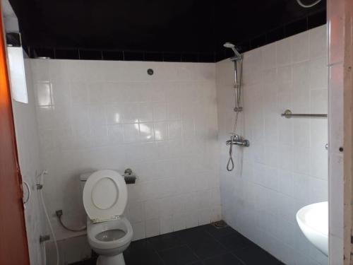 a bathroom with a toilet and a sink at Cool feel rest and cafe in Nuwara Eliya