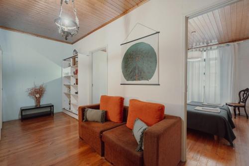 a living room with a couch and a table at Alegria Four - Bedroom House in Porto