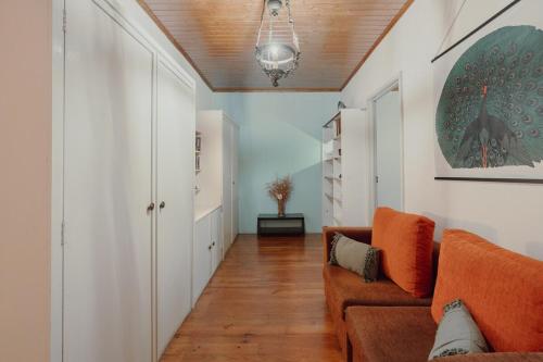 a living room with a couch and a table at Alegria Four - Bedroom House in Porto