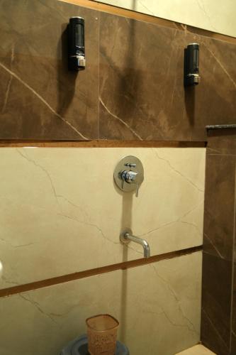 a bathroom with a shower with a faucet at Aastha view inn in Amritsar