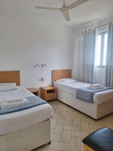 a bedroom with two beds and a window at T2 Apart - Beach View - Santa Maria Center in Santa Maria