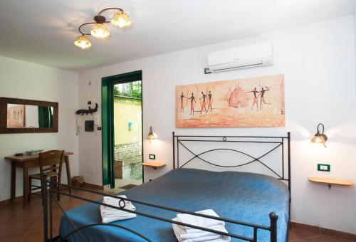 a bedroom with a blue bed in a room at B&B La Nave in Naples