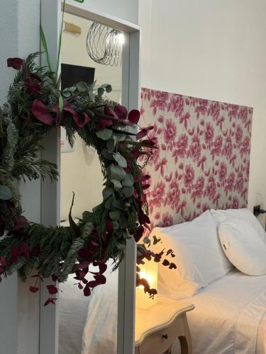 a bedroom with a christmas wreath on a bed at Apartamento Casa Nela in Medellín