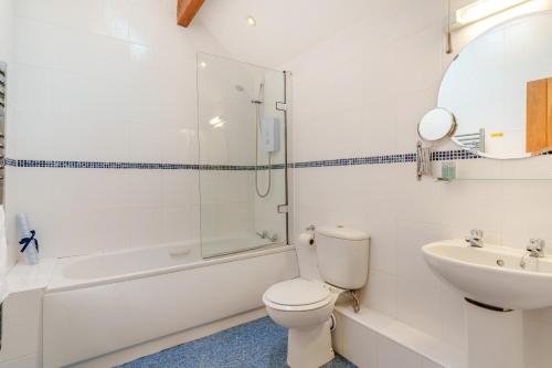 a bathroom with a toilet and a sink and a shower at 2 Bed in Ingleton oc-h34470 in Ingleton