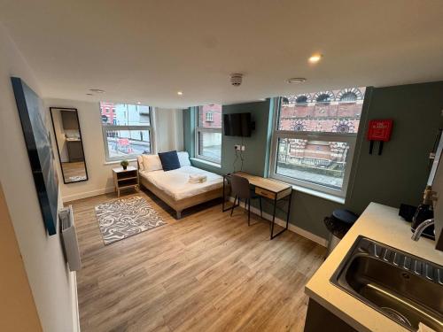 a small living room with a couch and a table at Studio Flat Close to Queen Square - Flat 2B in Bristol