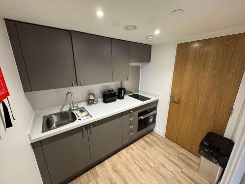 a small kitchen with a sink and a counter at Studio Flat Close to Queen Square - Flat 2A in Bristol