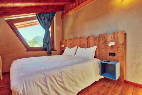 Un pat sau paturi într-o cameră la Moncervin