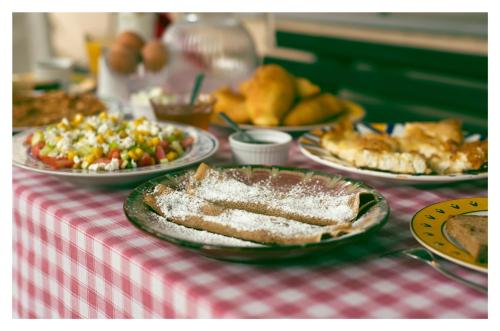 a table topped with plates of food on a table at Archontiko Stamou in Zagora