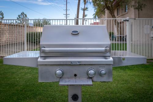 a grill sitting in the grass in a yard at Indian Palms Vacation Club in Indio