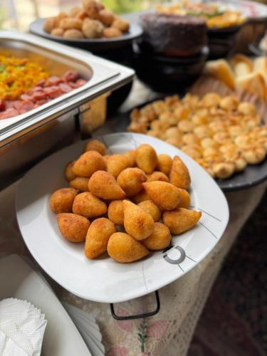 a plate of food on a table with food at Hostel do atleta in Belo Horizonte