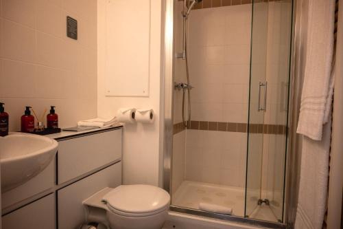 a bathroom with a shower and a toilet and a sink at Westminster College in Cambridge