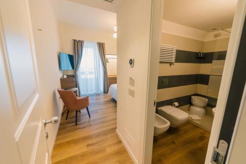 a small bathroom with a toilet and a room at Splendide Riviera Boutique Art Hotel in Rapallo