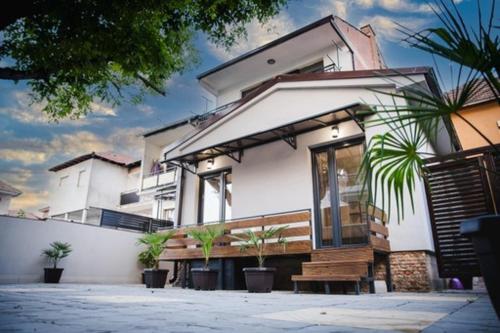 a house with a bench in front of it at Zen Apartments in Strumica