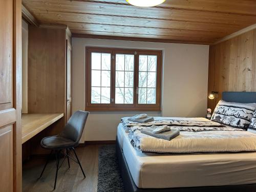 En eller flere senge i et værelse på Chalet Acadia