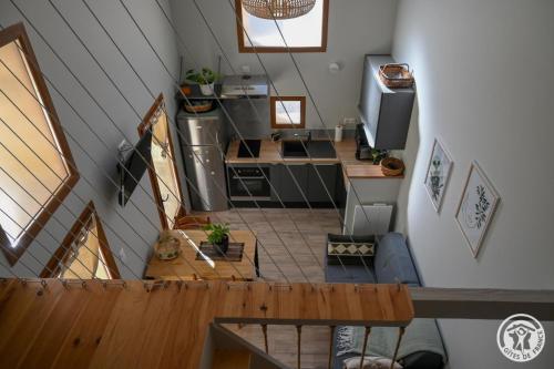 an overhead view of a kitchen in a tiny house at L'écrin de lacoste in Chasteaux