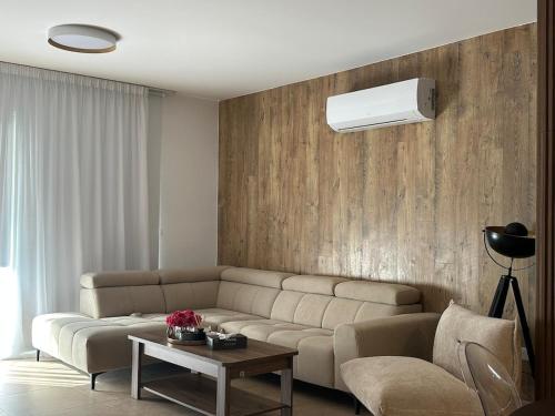 a living room with a couch and a table at CityLink-3Bedrooms Appartment CityCenter in Limassol