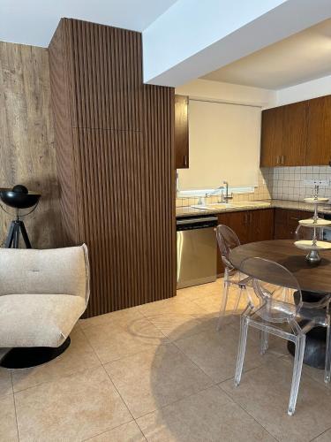 a kitchen with a table and chairs in a room at CityLink-3Bedrooms Appartment CityCenter in Limassol