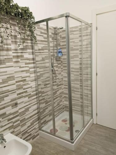 a shower stall in a bathroom with a sink at La Casa delle Onde B&B in Pescara