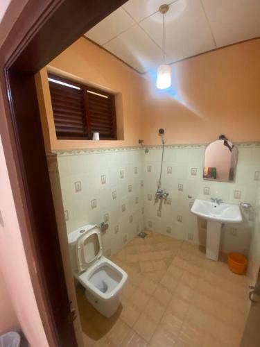 a bathroom with a toilet and a sink at Mayura Beach Resort Matara in Matara