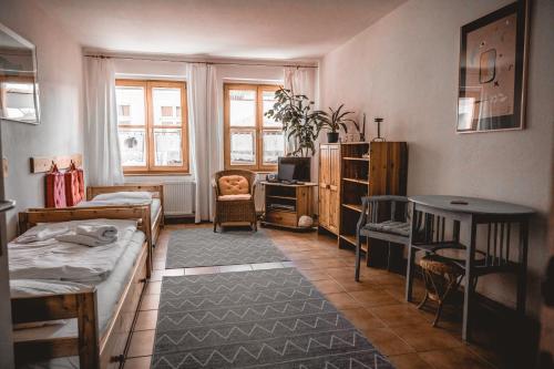 a small room with two beds and a desk at Haffliebe in Ueckermünde