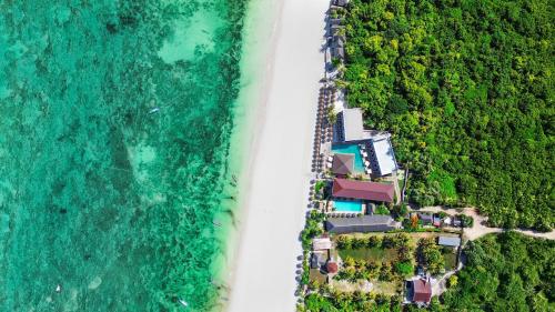 an aerial view of a beach and the ocean at AHG Sun Bay Mlilile Beach Hotel in Matemwe