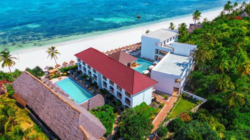an aerial view of a house on the beach at AHG Sun Bay Mlilile Beach Hotel in Matemwe