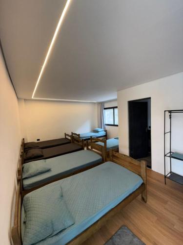 a room with two bunk beds in it at Resilience Igaratá in Igaratá