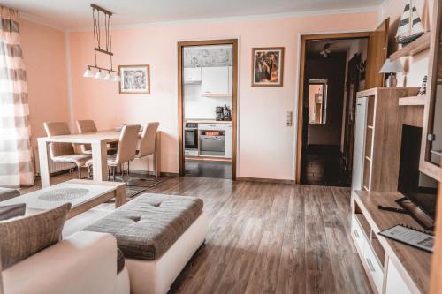 a living room with a couch and a table at Lagunenstadt am Haff - 146 Oberlicht in Ueckermünde