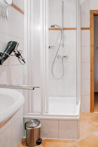 a bathroom with a shower and a sink at Ferienhof Werner in Emstek