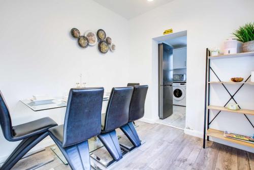 a dining room with a table and chairs at Newly Refurbished 3 Bed 2.5 Bath House in Staines in Staines