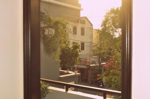 a view of a balcony from a window at Green CoCo HomeStay in Hoi An