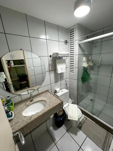 a bathroom with a toilet and a sink and a shower at Hotel em Barreirinhas in Barreirinhas