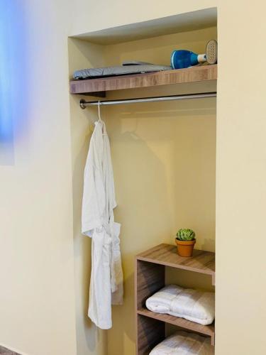 a towel hanging on a rack in a bathroom at Utopía Hotel Boutique in Mexico City