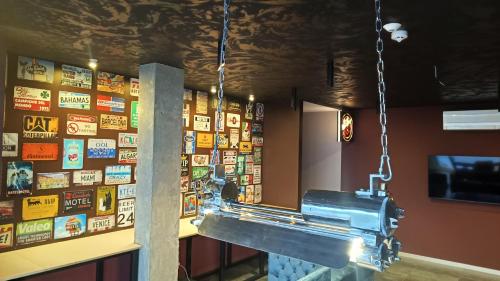 a room with a wall of signs on the wall at Mycelio Atlantic Residence with Atlantic View in Ribamar