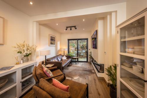 a living room with a couch and a table at Downshire Haven in Holywood