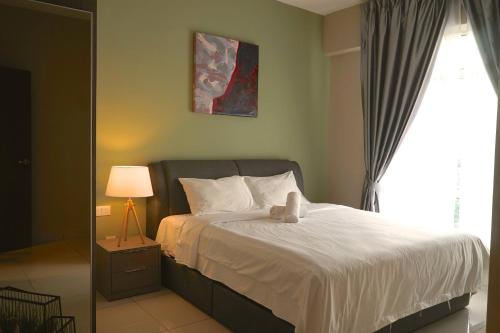 Una cama o camas en una habitación de The Majestic Ipoh by The Osborne