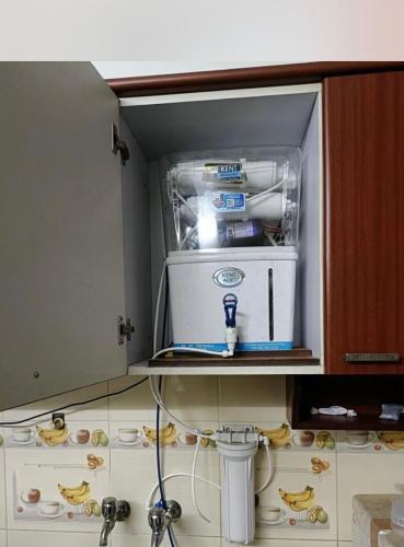 a small appliance in a kitchen on a shelf at 2bhk corporate home in Sohāna