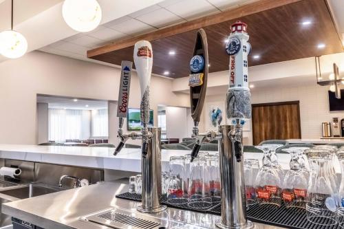 a bar with wine glasses on a counter at Staybridge Suites Halifax - Dartmouth by IHG in Halifax