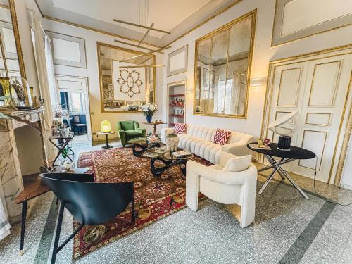 a living room with a couch and a table at Luxury Apartment in Lucca in Lucca