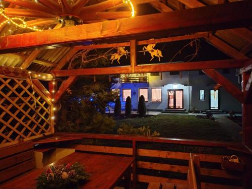 a room with a table and a building with lights at Vendel Guesthouse in Mereni