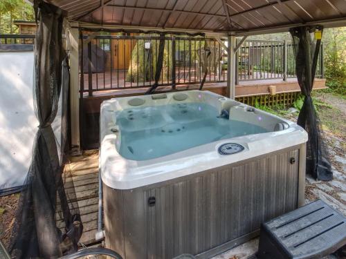 a hot tub in a gazebo at Hot tub Oasis Among Trees - Pet Friendly in Port Renfrew