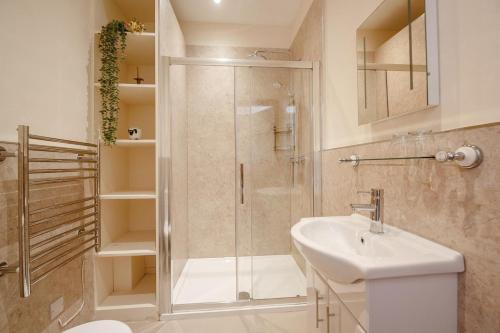 a bathroom with a shower and a sink at 3 Bed in Llanrwst oc-bow155 in Llanrwst
