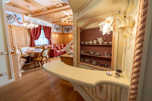 a living room with a table and a dining room at Villaggio Hotel Aquila in Calliano