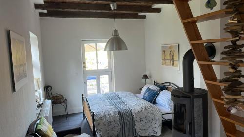 a bedroom with a bed and a fireplace in it at Hotel Lili Marleen in Travemünde
