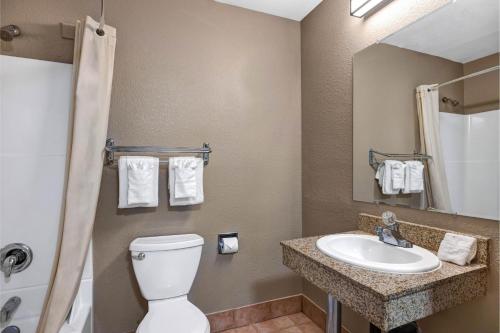 a bathroom with a toilet and a sink at Motel 6 - Motel 6 Portland, OR - Downtown in Portland