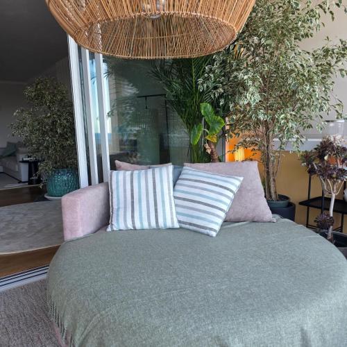 a bedroom with a bed with two pillows on it at Casa Azul in Luz
