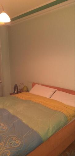 a bed in a bedroom with avertisementatronatronatronstrationstrationstration at Ranč Petar Alavanja Banstol in Sremski Karlovci