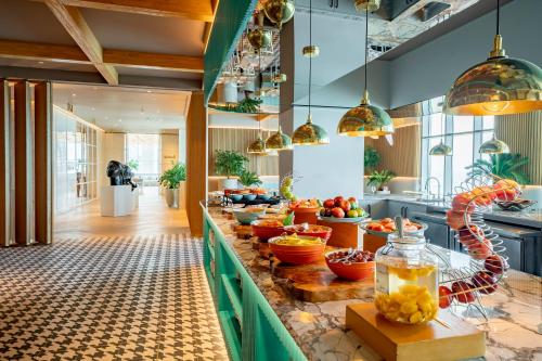 a kitchen with a counter filled with lots of food at Hyatt Regency Cartagena in Cartagena de Indias