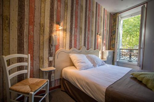 Postel nebo postele na pokoji v ubytování Logis hôtel du terreau